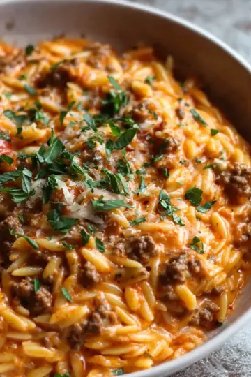 Ground Beef Orzo with Tomato Cream Sauce and Fresh Basil
